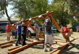 Kings Lions and Lowe's employees join forces to help out at the Lemoore Senior Center recently.